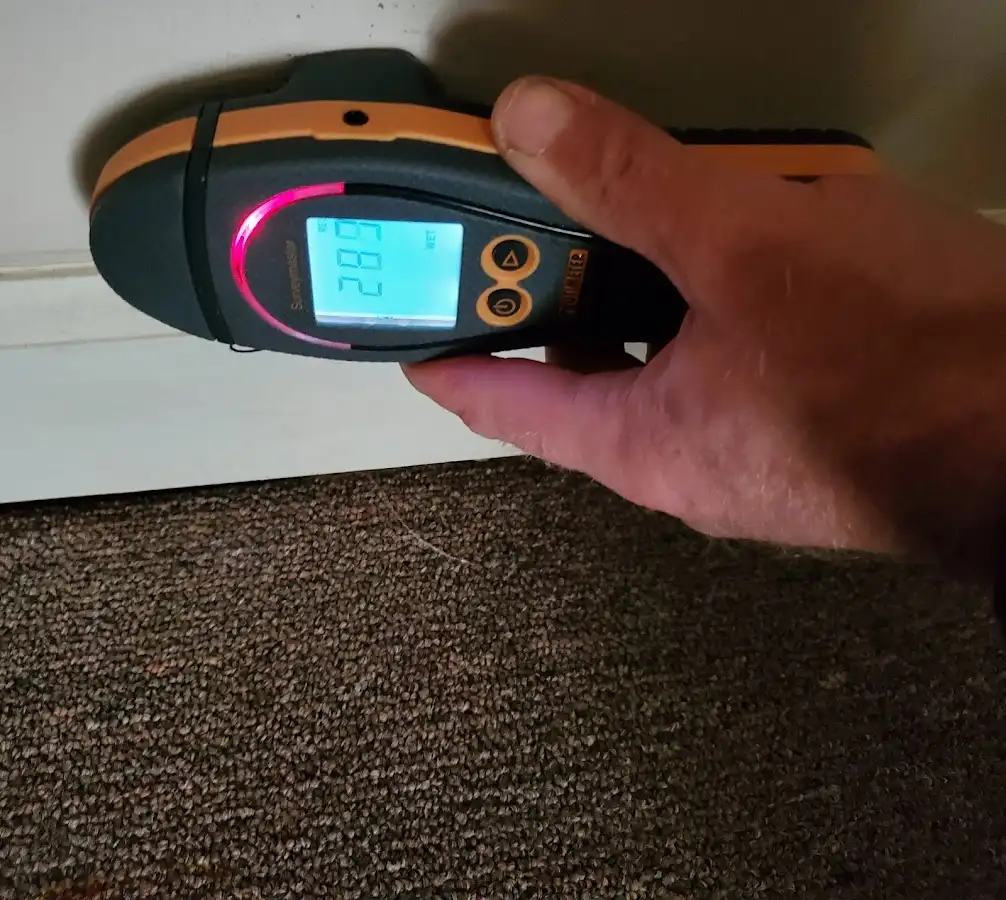 Moisture detection at baseboard during Storm Damage Restoration in Uvalde